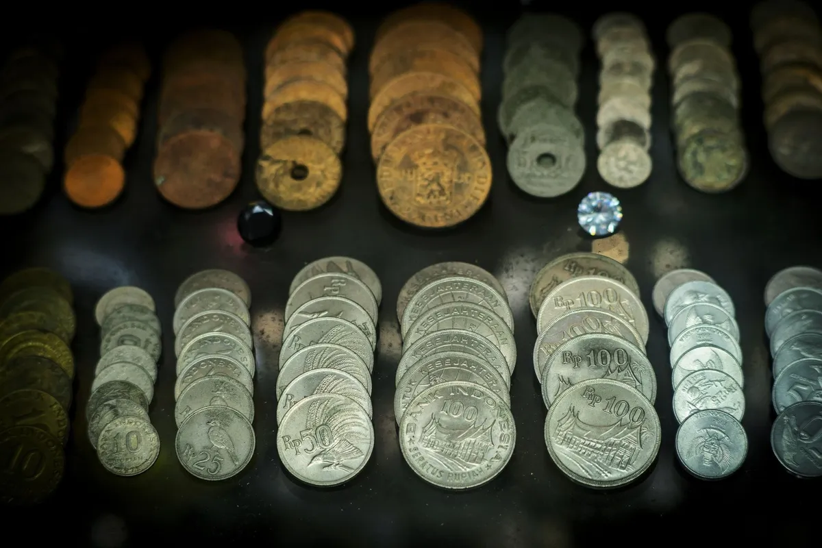 A collection of antique Indonesian coins, highlighting historical currency for potential selling opportunities.